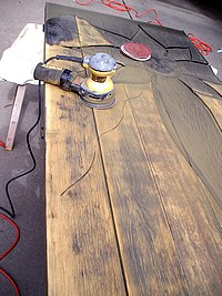 Removing the Previous Finish with a Power Sander.