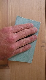 Remove blemishes before staining wood.