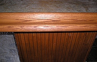 Stainied oak trim and bead board.